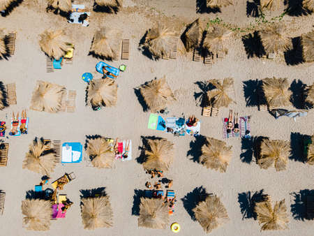 Aerial Beach, People And Umbrellas On Beach Photographyの写真素材