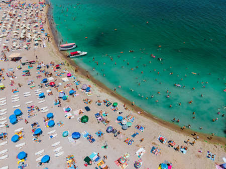 Aerial Beach Drone Photography, People And Umbrellas On Sea Beachの写真素材
