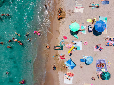 Aerial Beach Photography, People And Colorful Umbrellas On Seaside Beachの写真素材