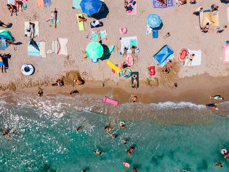 Aerial Beach Photography, People And Colorful Umbrellas On Seaside Beachの写真素材