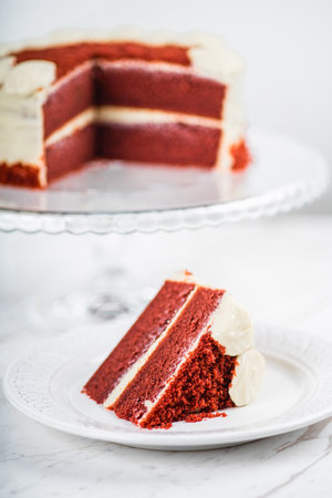 Red Velvet Cake Slice on Marble Table Backgroundの写真素材