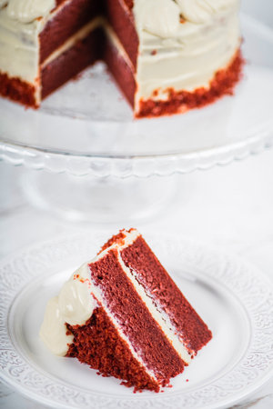 Red Velvet Cake Slice on Marble Table Backgroundの写真素材