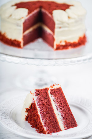 Red Velvet Cake Slice on Marble Table Backgroundの写真素材