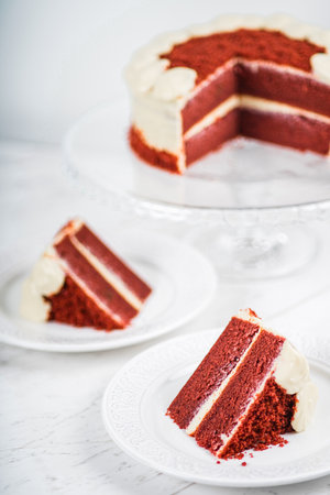 Red Velvet Cake Slice on Marble Table Backgroundの写真素材