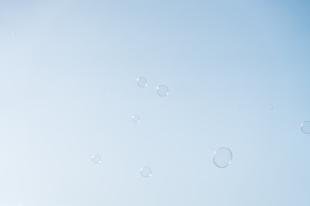 Soap Bubbles Floating On Blue Skyの写真素材