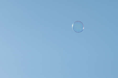 Soap Bubbles Floating On Blue Skyの写真素材