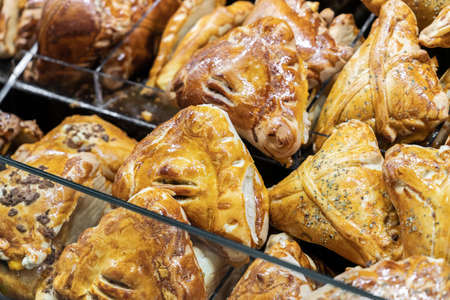 Empanada is a baked or fried pastry and meat, cheese, tomato, corn, or other ingredient stuffed filling common in Southern European, Latin American, and the Philippines culturesの写真素材