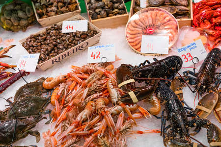 BARCELONA, SPAIN - JUNE 14, 2019: Fresh Fish And Seafood On Ice In Fish Marketのeditorial素材
