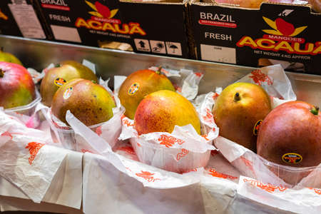 BARCELONA, SPAIN - JUNE 14, 2019: Healthy Fresh Mango Fruits For Sale In Fruit Marketのeditorial素材