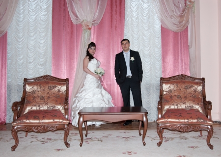 bride and groom in the living roomの写真素材