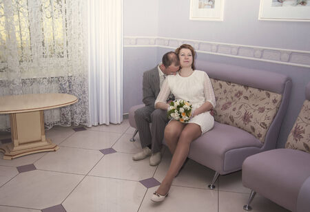 bride and groom are celebrating the wedding interiorの写真素材