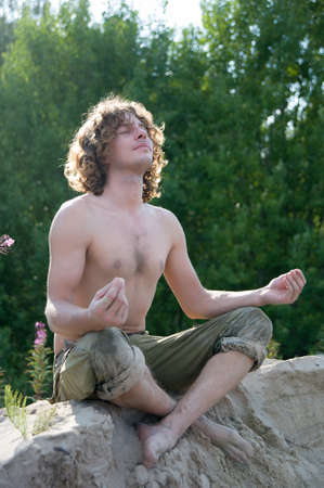 handsome man outdoors in the summer on the forest backgroundの写真素材