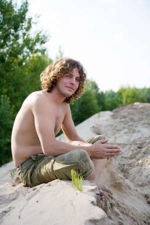handsome man outdoors in the summer on the forest backgroundの写真素材
