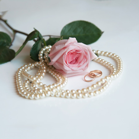 wedding ring with rose and white pearlsの写真素材