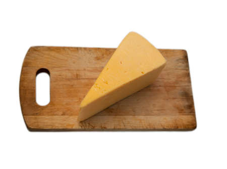 cheese lying on wooden board isolated backgroundの写真素材