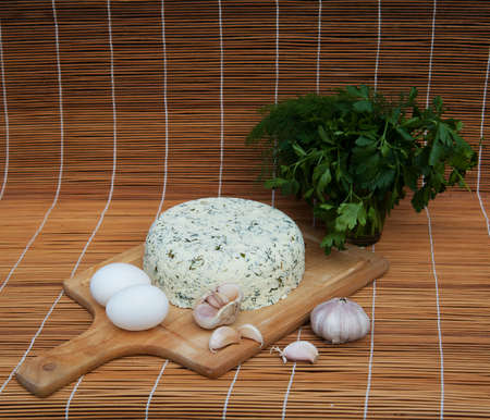 Homemade goat cheese with eggs, garlic and herbsの写真素材