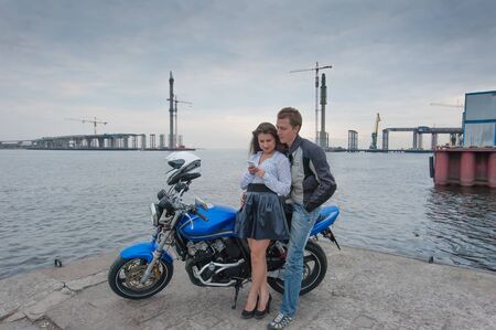 Couple in love on the beach with the bike