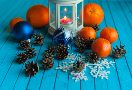 tangerines and oranges are on the blue tableの写真素材