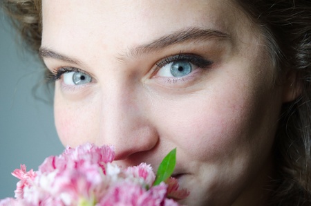 Young girls with flovers,  beautiful smile and eyes