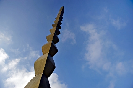 Constantin Brancusi Endless Column silhouetted against blue sky in Targu Jiuの写真素材