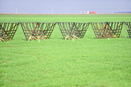 Snow fences build against future snowstorms are seen near a highwayの写真素材