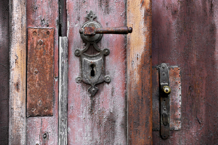 Old and rusty door handle and door lockの写真素材