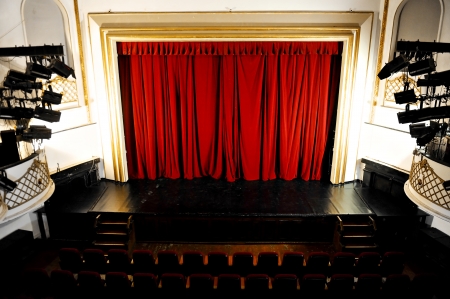 Empty theater stage with lights on and curtain brought downのeditorial素材