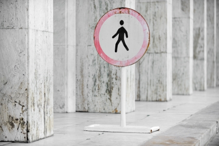 Old and rusty pedestrian prohibited road sign の写真素材