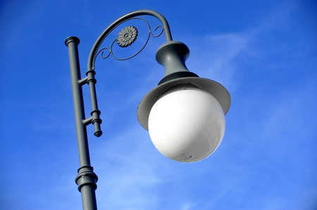 Outdoor public lighting pole with blue sky on backgroundの写真素材
