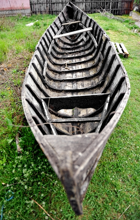 Rural scene with abandoned wooden fishing boatの写真素材