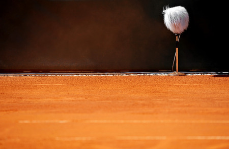 Detail with a professional sport microphone on a clay tennis courtの写真素材