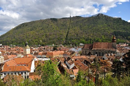 BRASOV, ROMANIA - APRIL 20: Downhill view with the Old Town of Brasov City on April 20, 2014 in Brasov, Romania.のeditorial素材