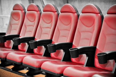 Empty coach and reserves red bench on a football stadiumの写真素材