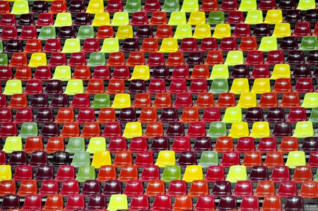 Detail with empty colored sports arena tribunes on a football stadiumのeditorial素材