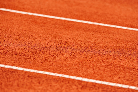 Detail with sidelines on a wet tennis clay courtの写真素材
