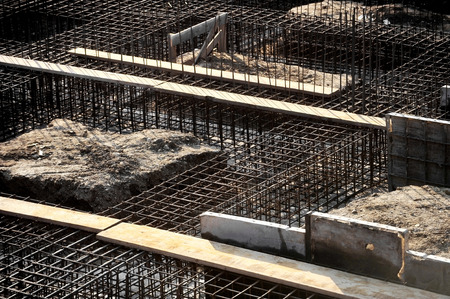 Construction site detail with iron rack for concrete pouring on a new building foundationの写真素材