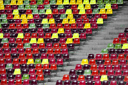 Detail with empty colored sports arena tribune on a football stadiumの写真素材