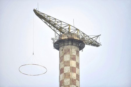 Industrial view with an abandoned parachute jump towerの写真素材