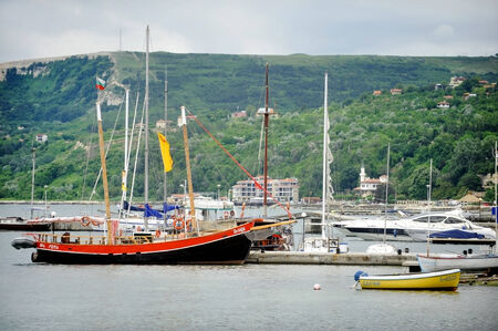 BALCHIK, BULGARIA - JUNE 16: Fishing boats and yachts are seen in the Black Sea coast town of Balchik, on June 16, 2014 in Bulgaria.のeditorial素材