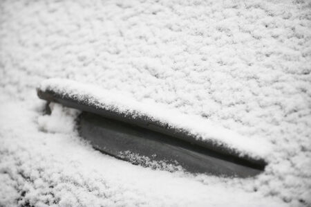 Detail with a car windshield wiper after snowfallの写真素材