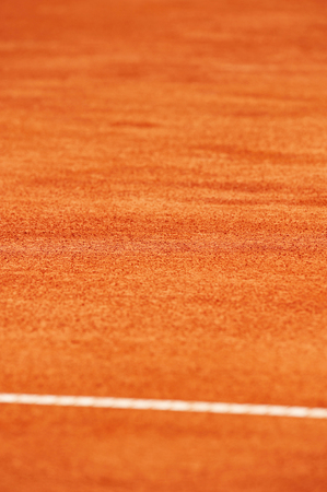 Surface level detail with on a wet tennis clay courtの写真素材