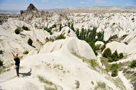 TURKEY, CAPPADOCIA - JUNE 23: One tourist trekking in the Rose Valley of Cappadocia on June 23, 2014 in Turkey.のeditorial素材