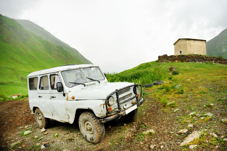 Abandoned off road old car on a mountainの写真素材