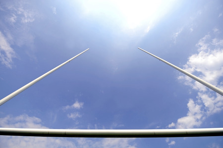 Rugby goal posts with stadium spotlights and blue sky on the backgroundの写真素材