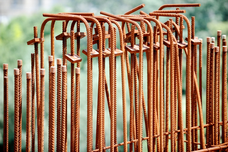 Rusty iron armature bars on a construction siteの写真素材