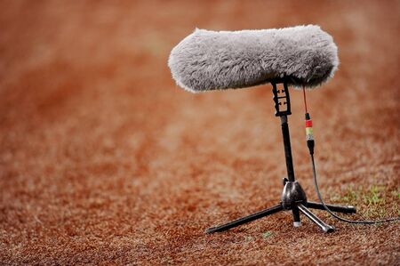 Big and furry sport microphone on a soccer fieldの写真素材