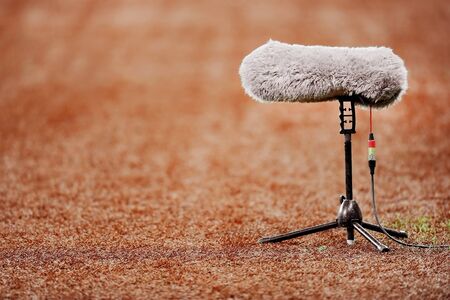 Big and furry sport microphone on a soccer fieldの写真素材