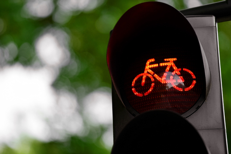 Detail shot with a bicycle traffic light switched to red color