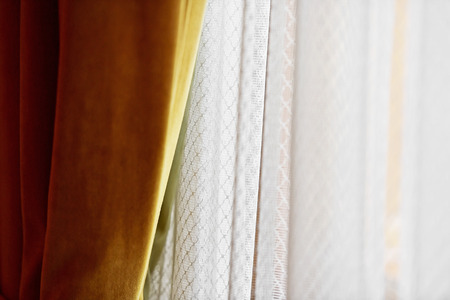 Sunlight enters room through elegant window curtainの写真素材