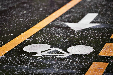 Rainfall on bicycle lanes in a park in springtimeの写真素材